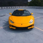 A yellow supercar at Rayne Exotic Motors showcasing high-end Atlanta rental options for luxury & rare performance vehicles.